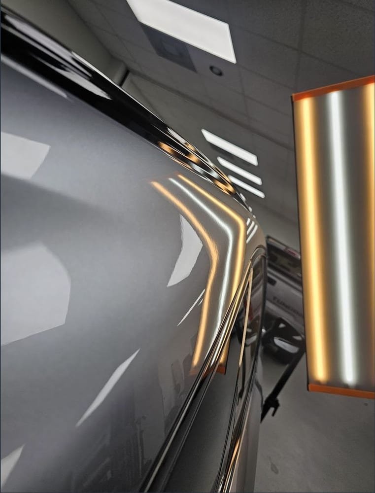 The same panel after repair, reflection lines running smooth