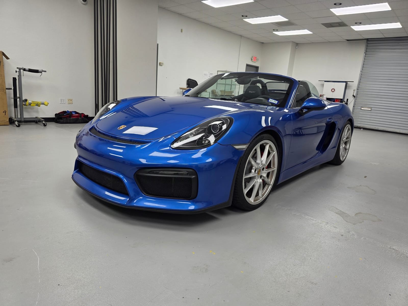 Blue Porsche Boxster Spyder in the shop, a car Ian has worked on