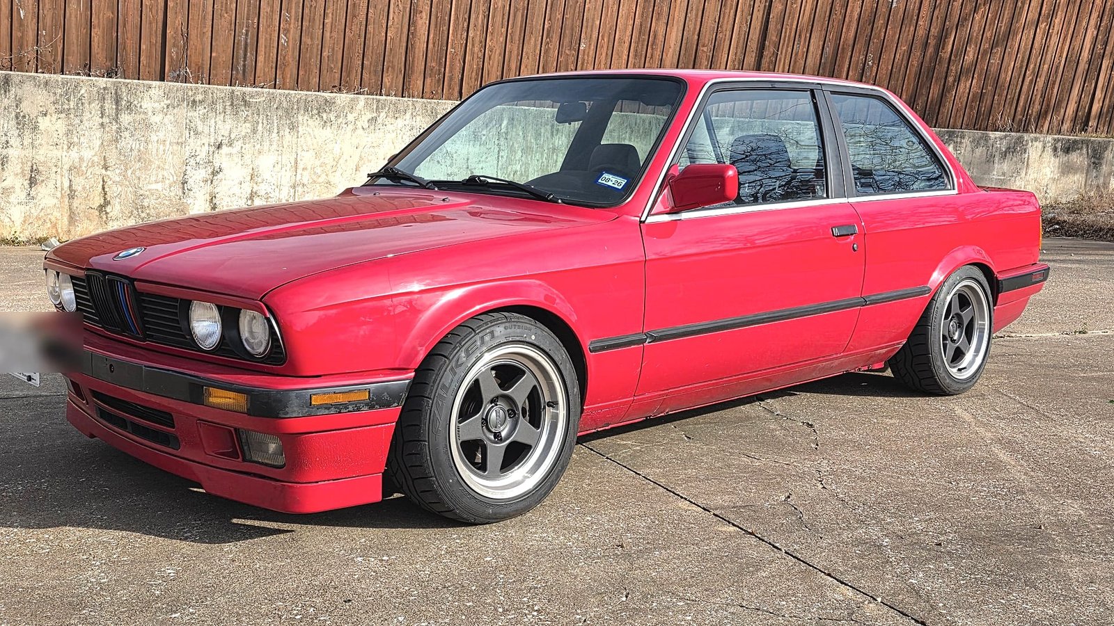 Ian's red BMW E30 325i, a car he has personally worked on